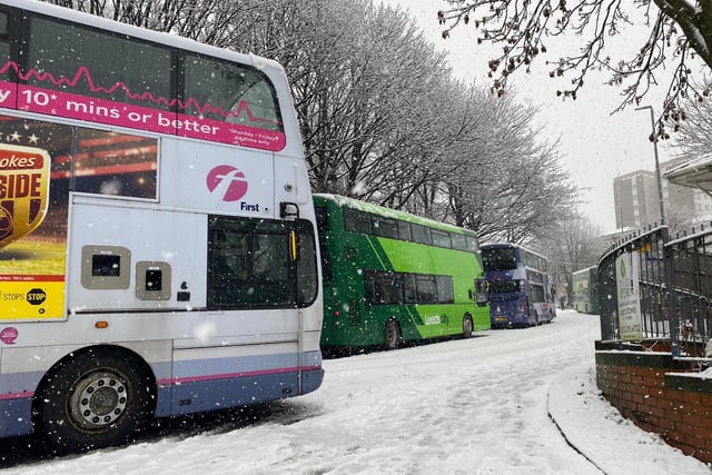 Double deckers parked up at either end of the road as the snow made conditions impassable