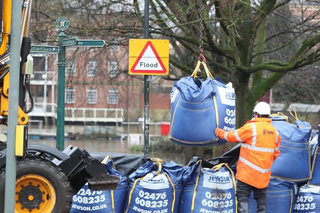 Workmen prepare flood defences near the River Ouse, York, as Storm Christoph is set to bring widespread flooding, gales and snow to parts of the UK. Photo: PA