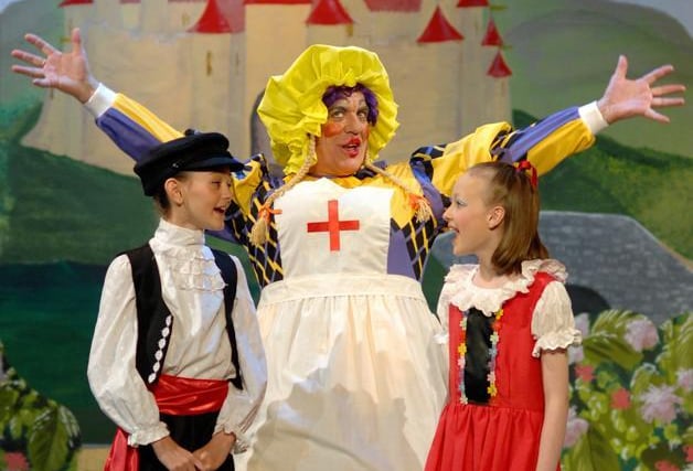 John Churnside as Nurse Nora Nausea with babe Tom and Jenny, Georgina Morris, and Beth Hurst, Wigan Little Theatre's production of Babes in the Wood 2009.