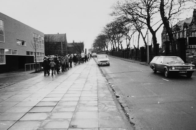 Children make their way to Hough Lane School in 1974.