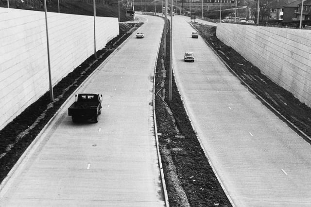 A view of a section of the Stanningley Bypass looking towards Leeds from the bridge on Swinnow Road in March 1971.