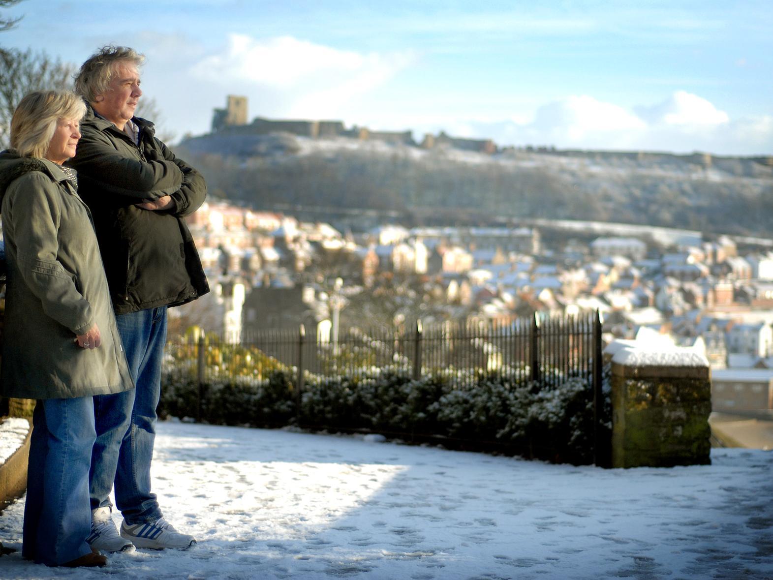 Visitors admiring Scarborough in winter, 100780a.