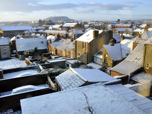 Snowy rooftops in the old town, 100781e.