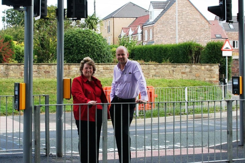 New traffic lights were installed on the A63/Lidgett Lane junction in Garforth in November. Pictured are Coun Andrea Harrison and Dave Richards.