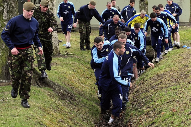 Midfielder Bradley Johnson leads from the front on the assault course.