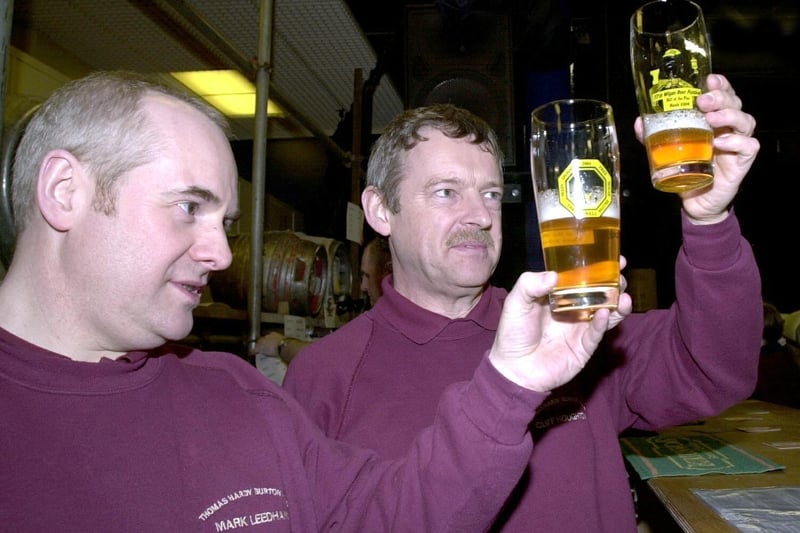 Checking the quality of their Top Hat beer, brewers from Thomas Hardy Burtonwood brewery Mark Leedham, left, and Cliff Houghton, who opened the 17th Wigan Beer Festival in 2004.