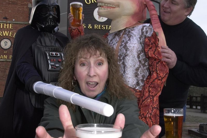 CAMRA members Pandy Alexander and Stan Morris come up against Star Wars characters Darth Vader and Jar Jar Binks in the battle to get their hands on the weird and wonderful brews on offer at the 14th Wigan Beer Festival being held at the Mill At The Pier in 2001.