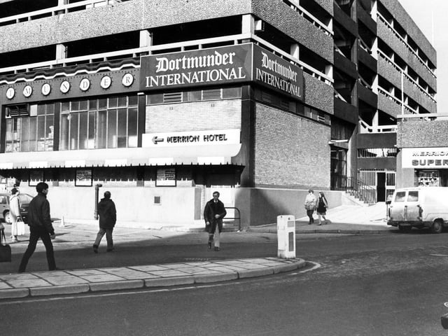 The Merrion Centre from Wade Lane, with the Dortmunder International public house in the centre pictured in February 1985. The entrance to the Merrion Centre Superstore is on the right.