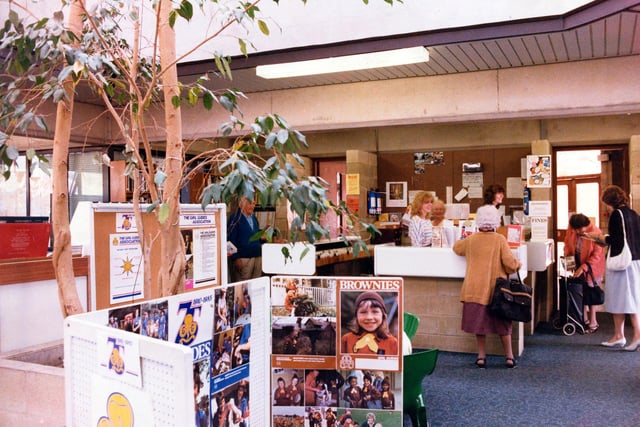 Horsforth Branch Library on Town Street in June 1985.. The adult lending section is located in the extension to the building opened in 1975. A display celebrating the 75th anniversary of the Girl Guide Association is seen in the foreground.