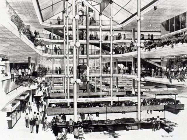 The plan for Kirkgate Market involved retaining the 1875 and 1904 Halls, but replacing the rest with a new single market hall, new shops, a new bus station and multi-storey car park. The scheme proved unpopular and was opposed by the Market Traders' Association as well as Leeds Civic Trust.