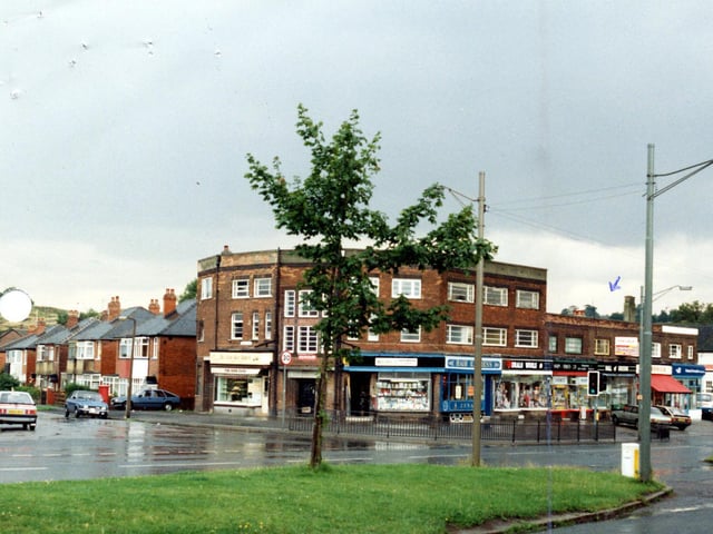 The junction of Selby Road and Dunhill Rise in October 1985. The row of shops include Wray's Hardware and DIY, Hair Express, a wool shop and a chemist.