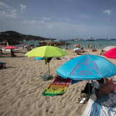 SPAIN: Tourists enjoy a sunny day at Cala Tadira beach. Photo: Getty Images