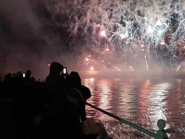 People capture the display on their phones while watching from The Bandstand in Whitby.