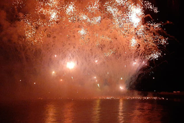 The night sky lit up red in the spectacular fireworks display.