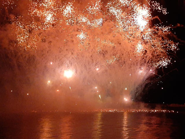 The night sky lit up red in the spectacular fireworks display.