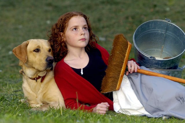 Megan Herbert, aged 11, playing 'Annie' in the production of Annie, at Castleford Civic Centre, also pictured her co-star Buddy.