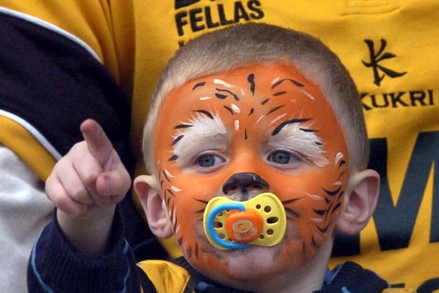 Castleford Tigers v Castleford Lock Lane, pictured a young Tiger's fan watching the match.