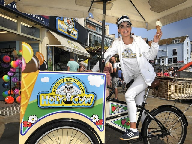On a scorching hot day down on Scarborough's South Bay Beach, Lauryn Lee enjoys an ice cream