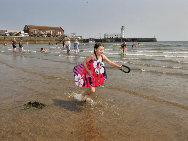 Mya Norton cools off in the sea in Scarborough's South Bay. The warm weather will stick around until Sunday August 14 and it could reach 30C in many parts of the region over the weekend