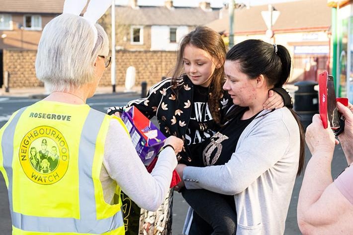 Members from Rosegrove Neighbourhood Watch handed out Easter eggs to young children
