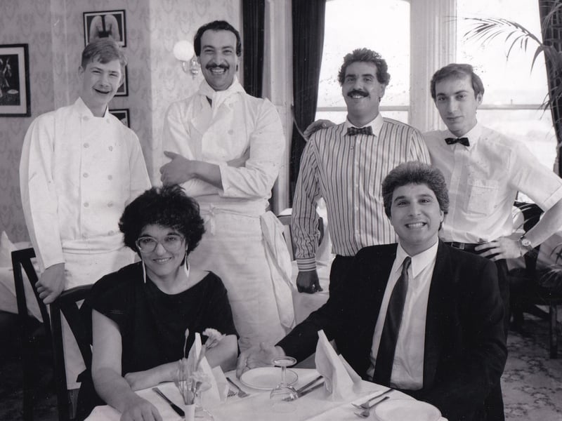 Owners Vasoulla and George Psarias (seated) at the Olive Tree restaurant in Rodley in September 1988. They are pictured with staff Paul Auty, Andrea Iacovou, Federico Orlandine and Pauolo Genco.