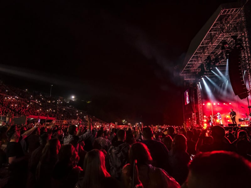The crowd lit up enthralled with the performance.