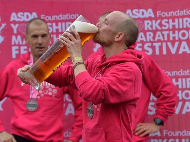 Race winner Tom Charles enjoys a pint and a bit