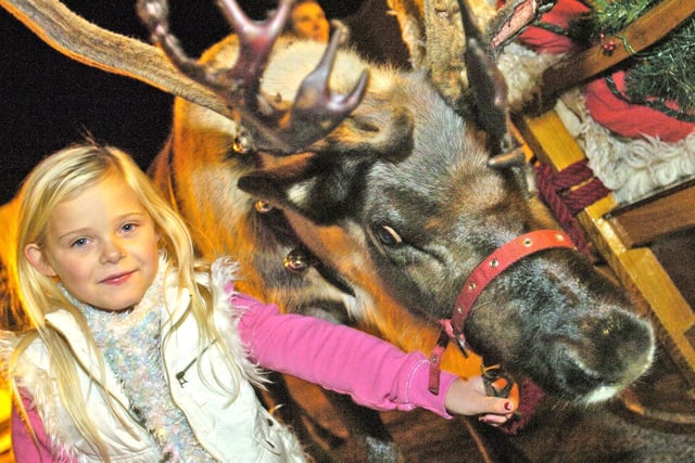 Abigail Richardson with one of Santa’s reindeer at the Lancaster Christmas lights switch-on in 2009.