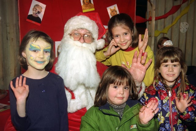 Special guest at Our Lady’s High School’s German  Christmas Market, Santa, finds himself a star attraction with all the children in 1997.