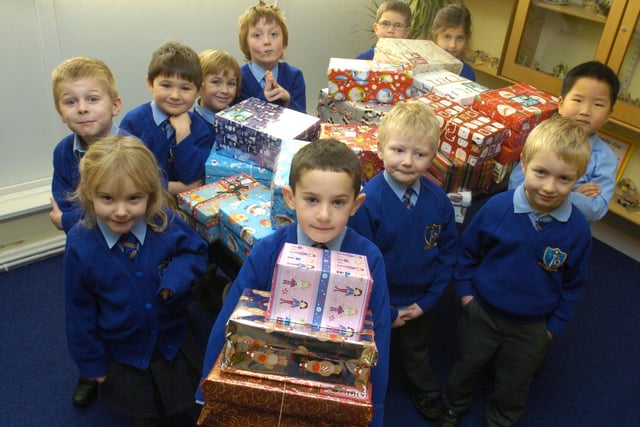 Children from St Bernadettes School, Lancaster with some of the shoeboxes collected for Operation Christmas Child.This was taken in 2008.