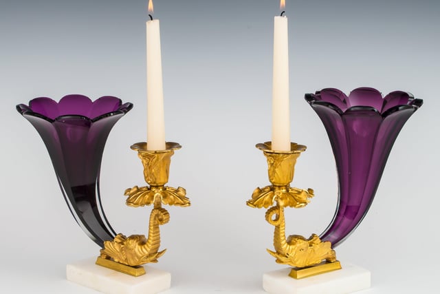 A fine pair of early Victorian amethyst cornucopia candle sticks, 1840, priced at £3,950 from Fileman Antiques.