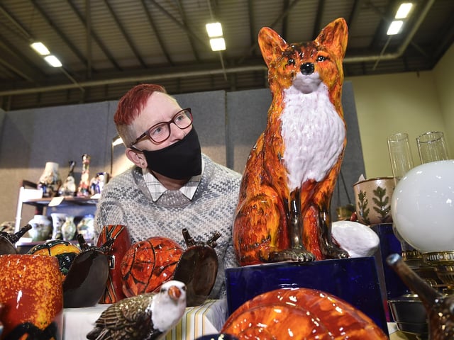 Antiques Fair at the Arena East of England showground. Dealer  Annette Mahan with her pottery EMN-200210-181432009