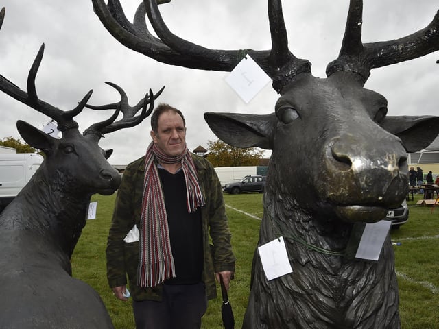 Antiques Fair at the Arena East of England showground. John Kotowski looking at life-size animals EMN-200210-181505009
