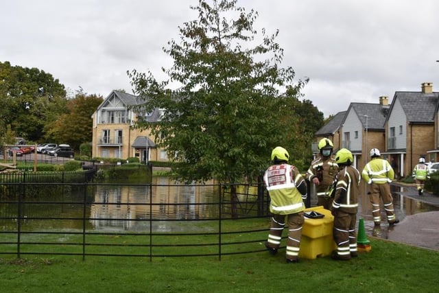 Flooding in Kingcup Avenue in front of children's play area (C) Ray Jordan