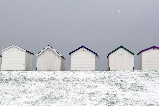 Snow by Worthing's beach huts