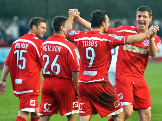 Crawley Town players celebrate one of Matt Tubbs' hat-trick