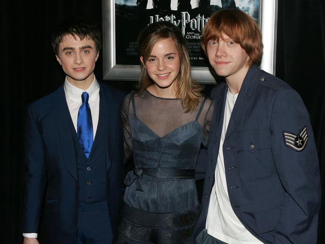 The spectacular white cliffs of Seven Sisters, between Seaford and Eastbourne in East Sussex, feature in this Harry Potter film. Pictured: Actors Daniel Radcliffe, Emma Watson and Rupert Grint at the premiere in New York in 2005. (Photo by Peter Kramer/Getty Images)