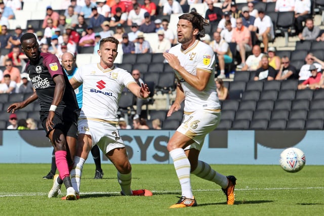August 2019: MK Dons 0, Posh 4. A brilliant Marcus Maddison strike opened this game up for Posh who won comfortably as Mo Eisa (2) and Ivan Toney also netted. Eisa is pictured scoring his first goal with a shot that travels past current MK boss Russell Martin.