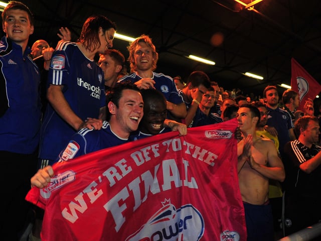 May 2011: Posh players celebrate their 2-0 League One play-off semi-final second leg win over MK. They would go on to beat Huddersfield 3-0 in the final at Old Trafford to seal an immediate return to Championship football.
