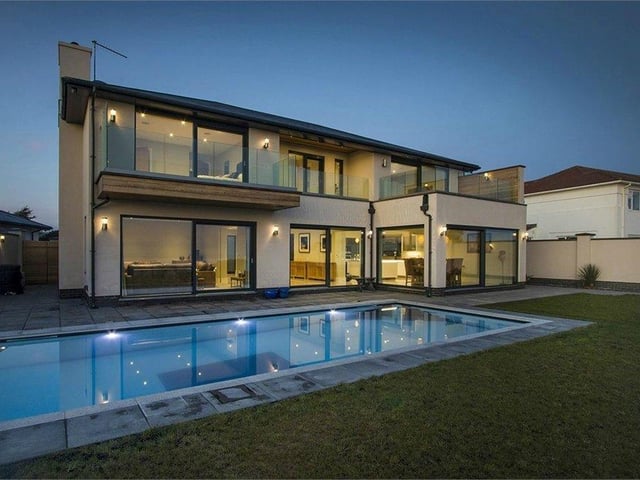 A beautifully designed seafront home that stands at the end of a long gated entrance with a heated pool and panoramic sea views across the coastline. Price: Offers over £2,375,000.