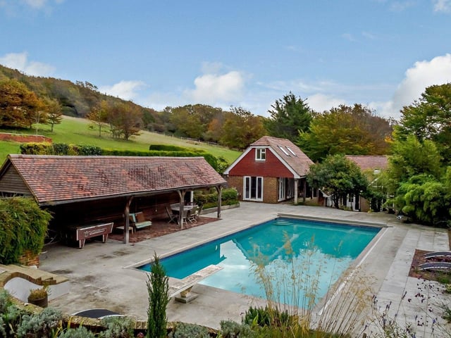 Substantial contemporary house with annexe in an elevated position with spectacular views over Cuckmere Valley. Price: £1,750,000.