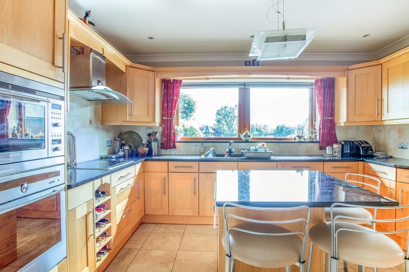 This Fully fitted kitchen has everything you need, with wall and base units. A sink and drainer incorporated into granite worktops. A range of integrated appliances including fridge/ freezer, dishwasher, electric oven with hobs and extractor fan over head. There's a Wall mounted radiator and a door leading to utility room.