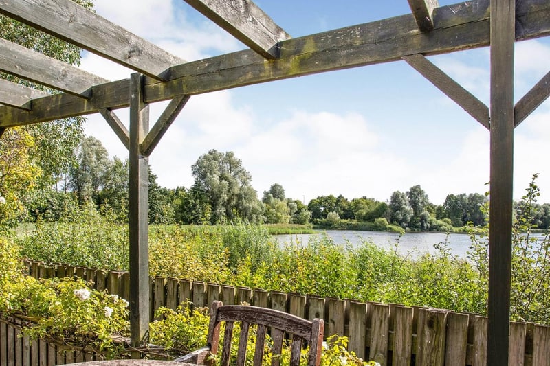 Here's the view from this property's private garden, showing Caldecotte lake in all its glory.