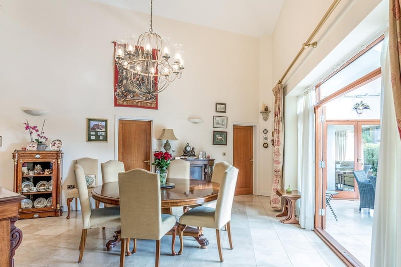 Despite being a Bungalow this dining hall is massive, the double patio doors lead to the garden room. The ceiling is 20 feet high. Whilst the roundtable comfortably fits six, currently there's plenty of room for expansion.