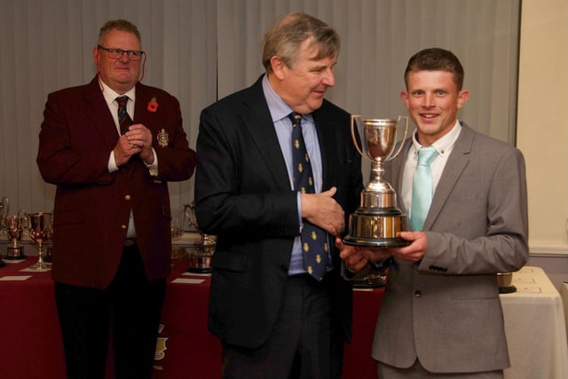 The Duke of Norfolk presents a Littlehampton Golf Club prize to Sean Franks, watched by Kit Magrath