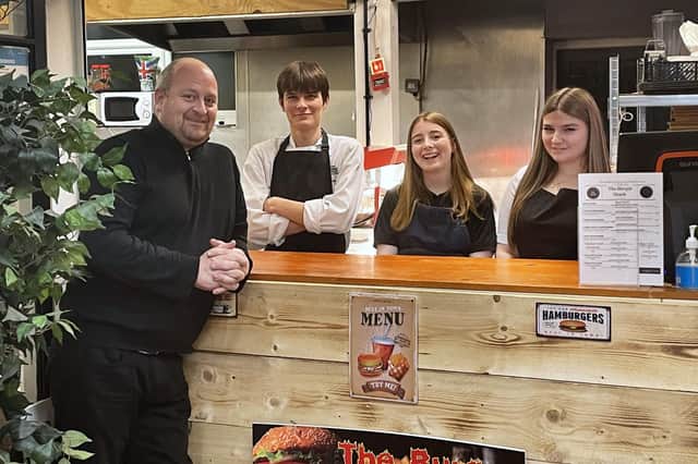 The Burger Shack team in Bexhill. (left to right) Lewis Rooney with Edward, one of the chefs, and cashiers Daisy and Emily. SUS-211117-145119001