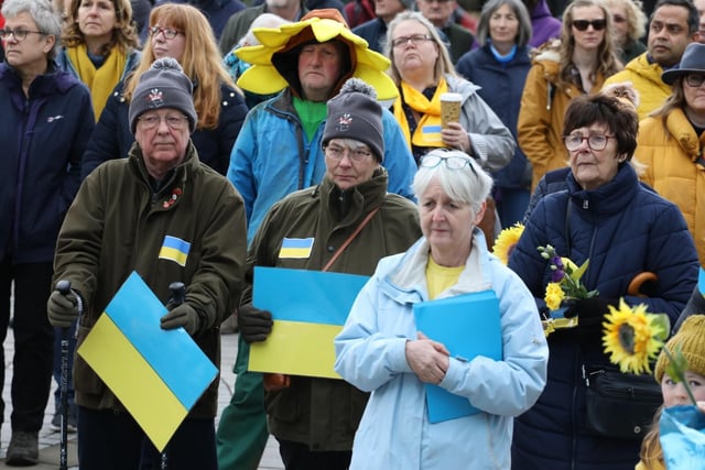 Many people wore blue or yellow or carried banners