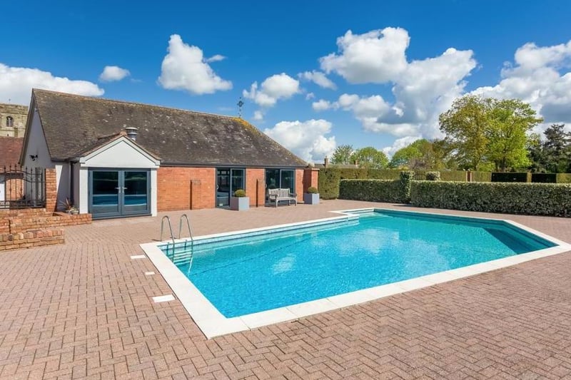 The home office and the swimming pool. Photo by Fine and Country