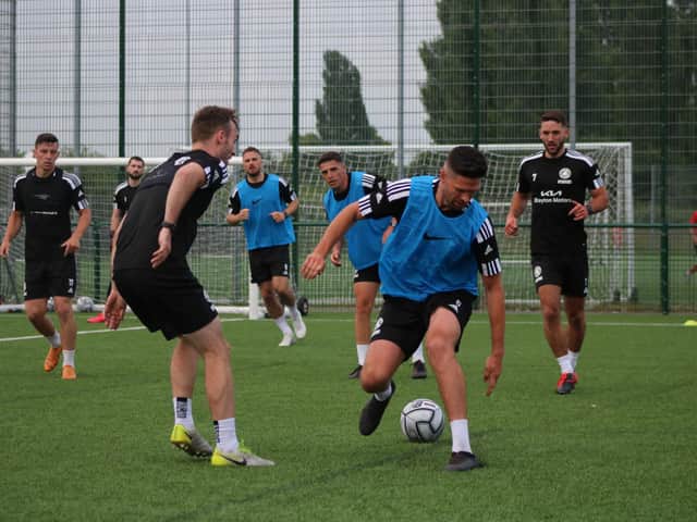 Scott Garner looks to nip past Shane Byrne. Photo: Oliver Atkin