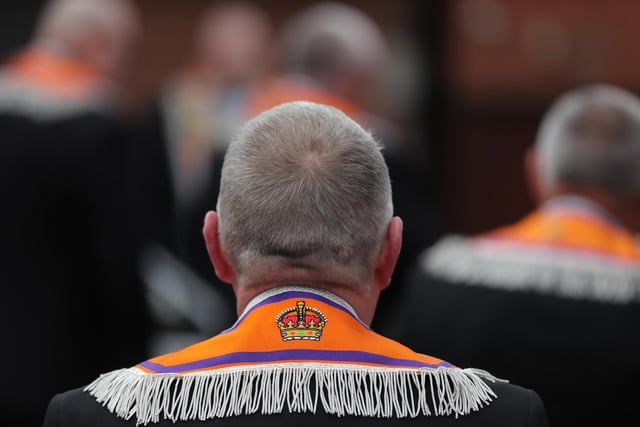 Orange Order members gather for a wreathe laying ceremony in east Belfast, as part of the social distanced Twelfth of July celebrations.